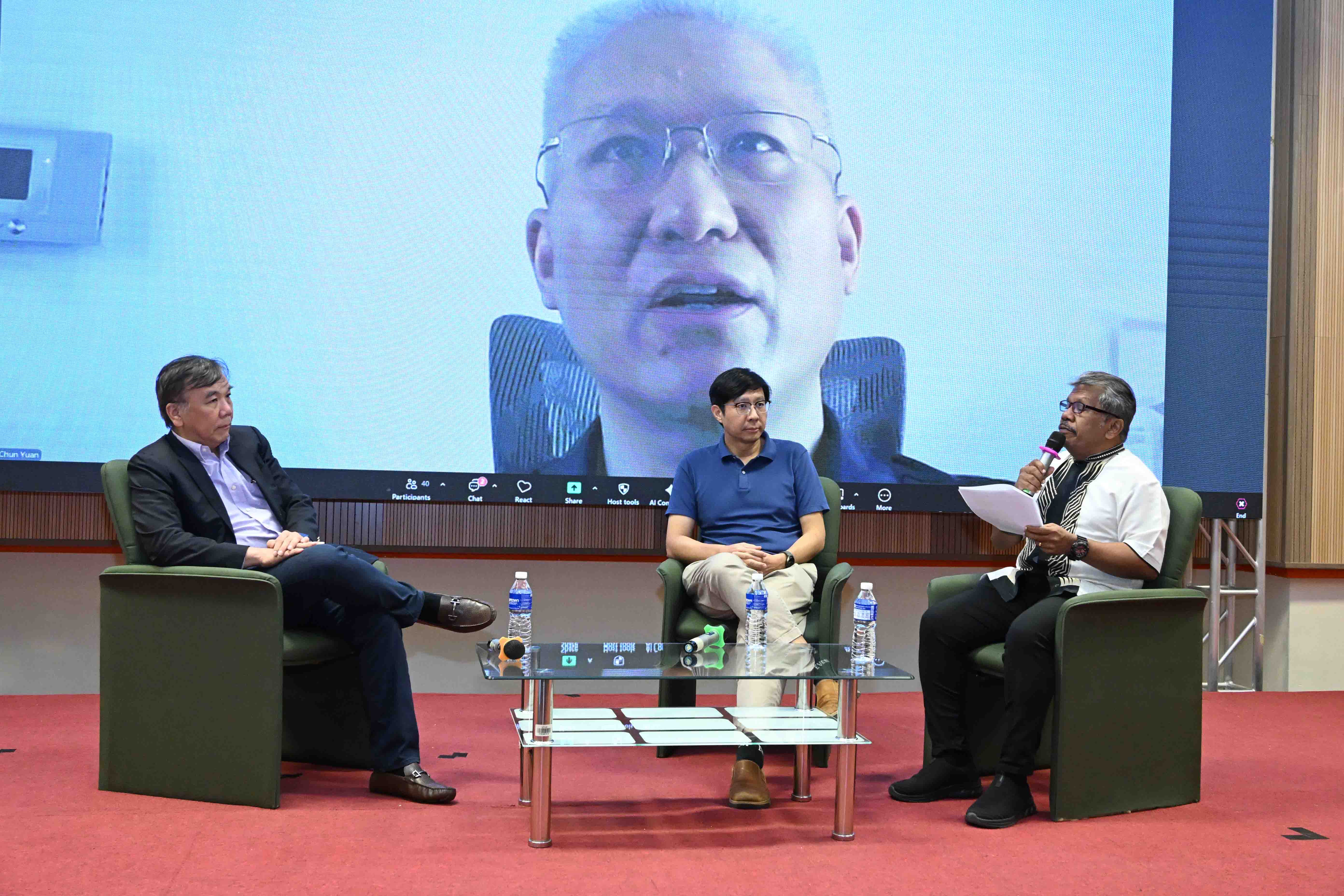 Mr Zachary Roland (most right) moderating the three-panel discussions with engaging questions